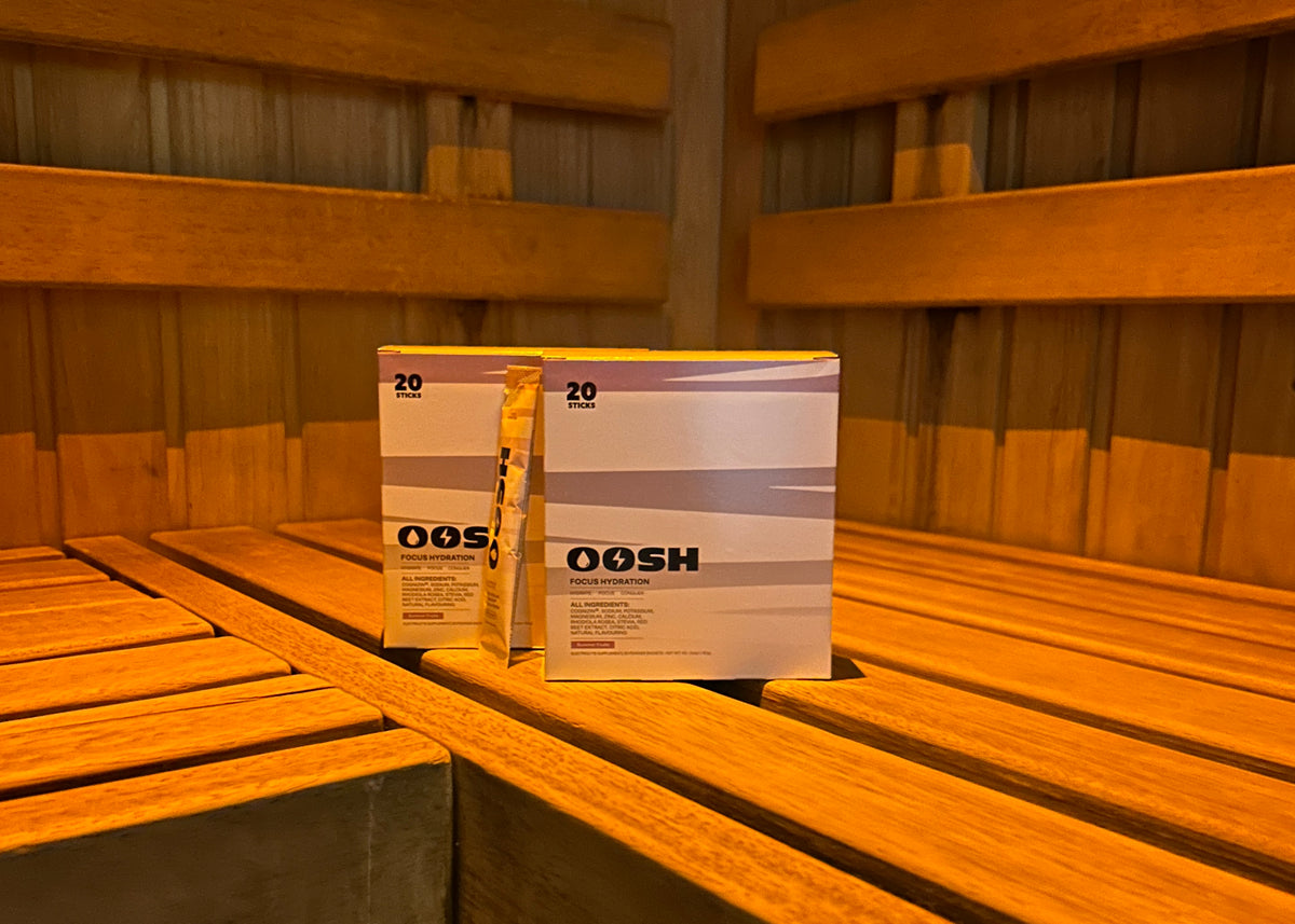 OOSH Focus Hydration boxes and sachets in a sauna setting